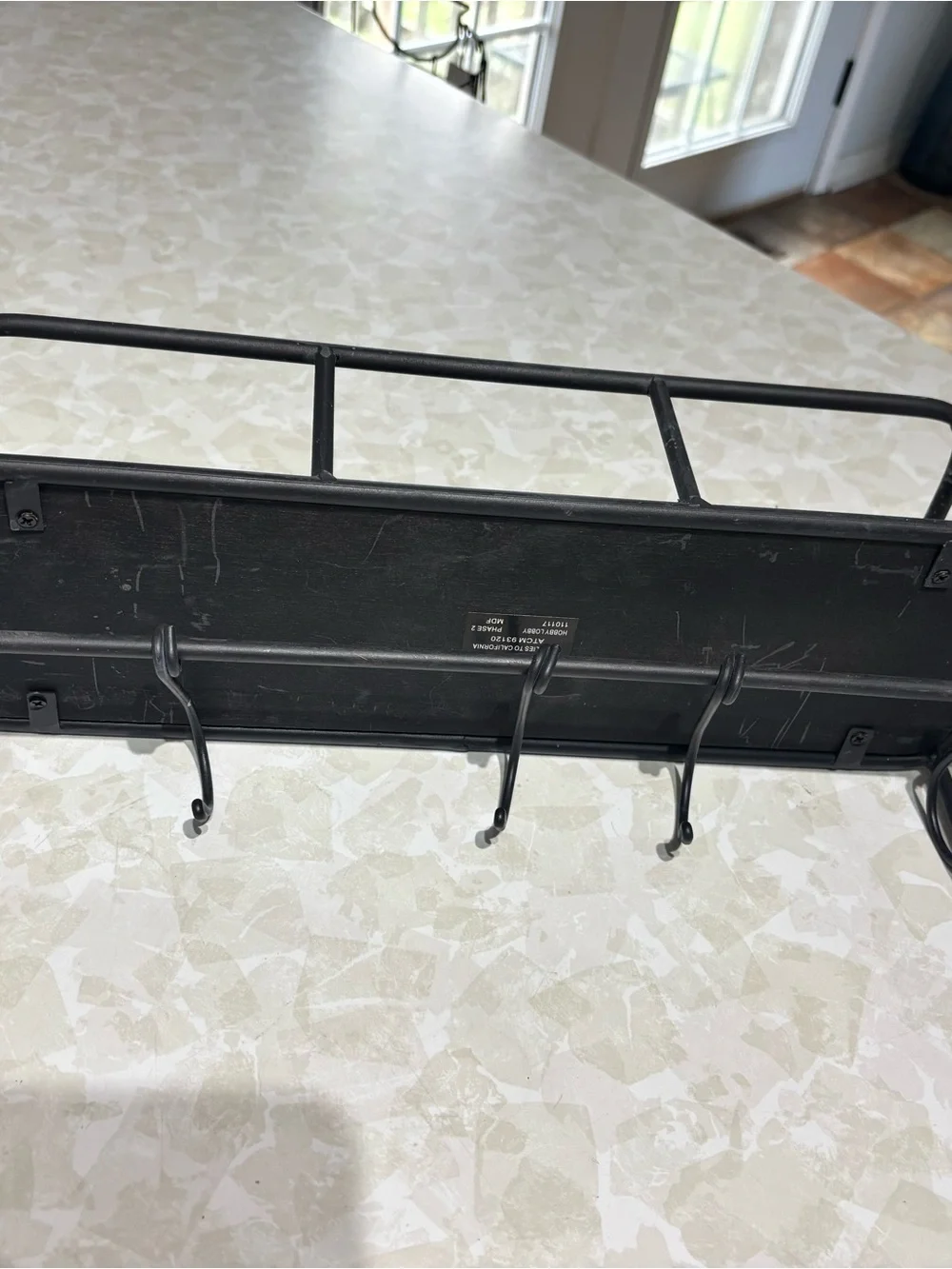 Rustic Black Metal Wall Shelf with Hooks and Wood Accent